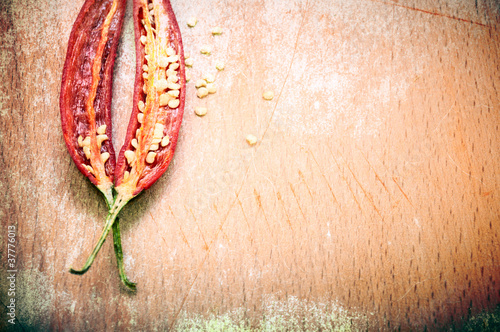 Photo: Peppers background in grunge style Peppers background in grunge style