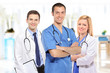 Medical team consisting of three smiling doctors