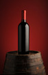 red wine bottle on wodden barrel red wine bottle on wodden barrel