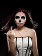 Young woman in day of the dead mask skull face art