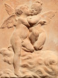 two kissing angels relief in tuscan terracotta, Italy