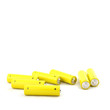 yellow old batteries on white background