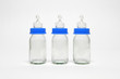 Three empty baby bottles in a row