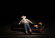Voodoo doll boy on a wooden table in the candlelight
