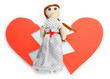 Voodoo doll girl on the broken heart isolated on white