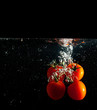 Tomatoes splash in water Tomatoes splash in water