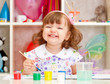 Photo: little girl paints paints little girl paints paints