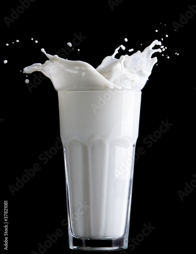 Photo: milk splash on black background milk splash on black background