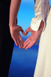 Couple With Hands Shaped like Hearts