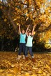 Happy Children With Colorful Fall Leaves Outdoors
