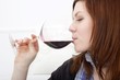 young woman drinking red wine