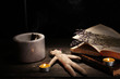 Voodoo doll boy on a wooden table in the candlelight