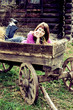 Attractive young woman resting in horse cart