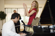 Piano player and singing girl
