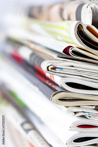 Photo: stack of magazines isolated on white stack of magazines isolated on white