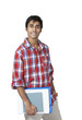Cute college guy holding books and notes
