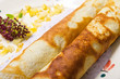 Pancake with marmalade, yogurt sauce and yellow fruits