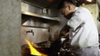 Video: Professional cook working in Asian restaurant kitchen Professional cook working in Asian restaurant kitchen