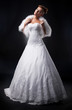 Attractive bride supermodel on podium shows wedding style