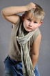 portrait of a young boy in the studio on a gray background
