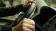 woman behind the wheel of a car