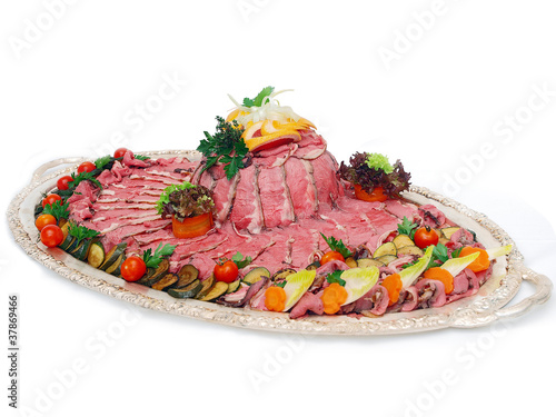 Photo: roast beef on silver platter roast beef on silver platter