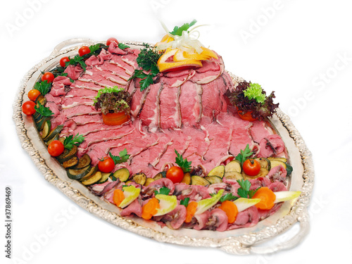Photo: roast beef on silver platter roast beef on silver platter