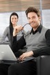 Handsome businessman smiling happily Handsome businessman smiling happily