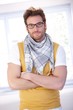 Handsome man standing arms crossed smiling