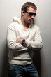 man with athletic standing near a wall