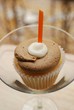 A two tone frosted sweet cupcake in a glass A two tone frosted sweet cupcake in a glass