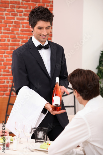 Photo: Sommelier presenting a wine Sommelier presenting a wine