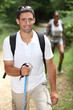 Interracial couple hiking in the forest