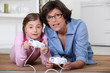 Mother and daughter playing video games