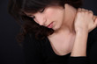 Woman suffering from neck pain