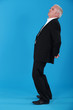 man standing back in profile against background