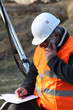 surveyor talking on the phone