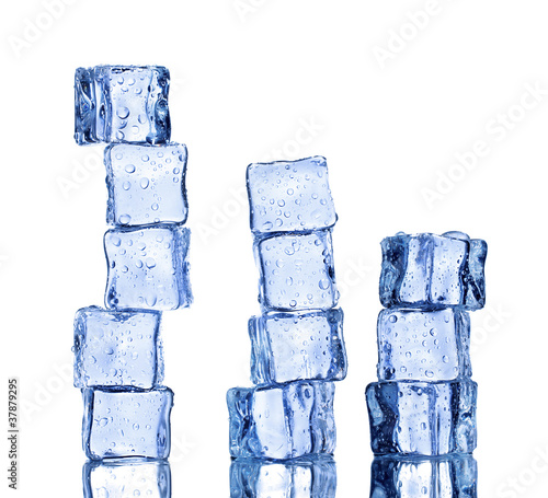 Photo: Melting ice cubes on blue background Melting ice cubes on blue background