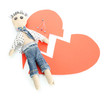 Voodoo doll boy on the broken heart isolated on white