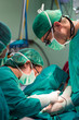 Surgeons team with electronic scalpel fr