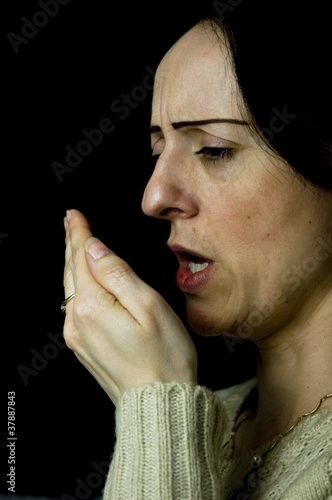black woman sneezing