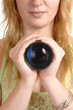Girl holding a photo lense.