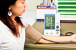 Doctor checking woman blood pressure