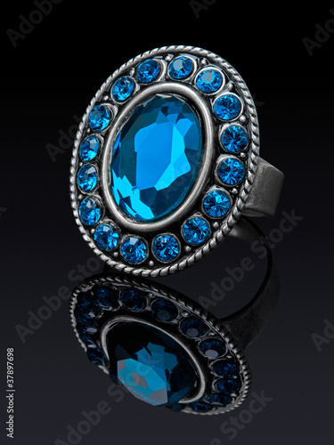Photo: Silver ring with blue stones (glass) with reflection. Silver ring with blue stones (glass) with reflection.
