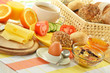 Breakfast including rolls, egg, cheese, coffee and orange juice