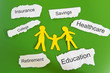 Paper cutout family with expenses on torn paper scraps