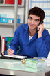 Worker with a phone and diary