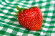 big juicy strawberries on green napkin
