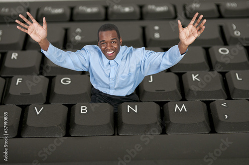 Photo: Man Using Computer Man Using Computer