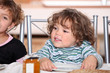 portrait of siblings having snack after school
